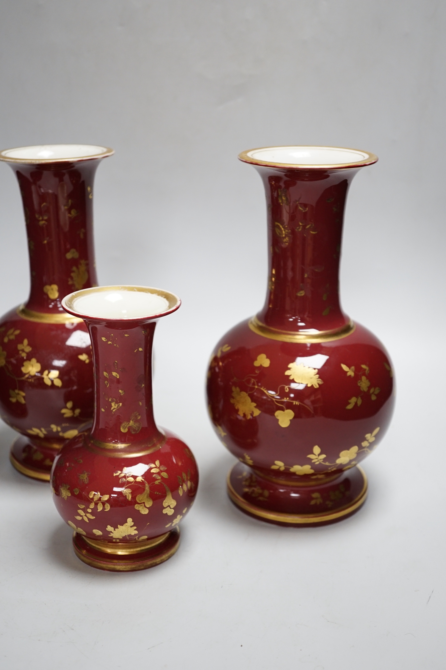 A pair of late 19th century French porcelain vases, and two others, tallest 25cm high